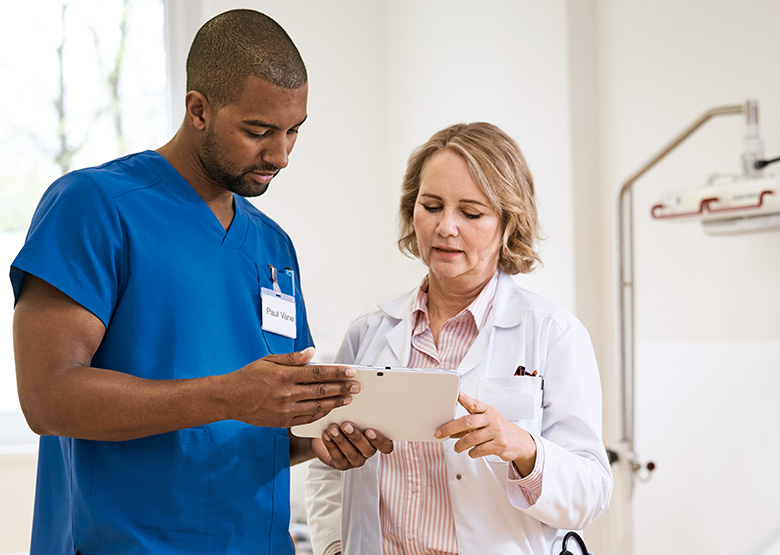 Image showing two nurses exchanging medical information. Image showing two nurses exchanging medical information.